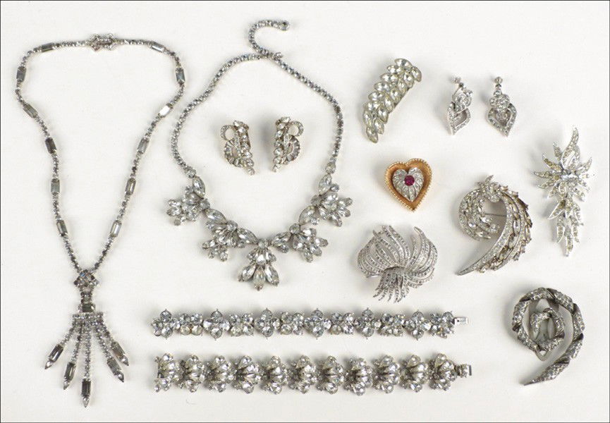 COLLECTION OF WHITE RHINESTONE JEWELRY.: COLLECTION OF WHITE RHINESTONE JEWELRY. Comprising bracelets, earclips, brooches, neclklaces, and dress clips by Trifari, Sarah Coventry, Ora, and Napier