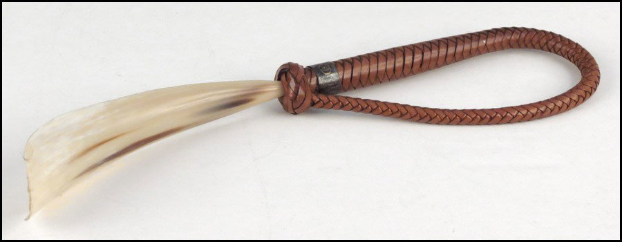 GUCCI HORN AND BRAIDED LEATHER SHOE HORN.: GUCCI HORN AND BRAIDED LEATHER SHOE HORN. Length: 14.5"