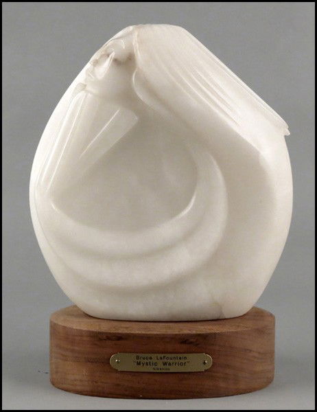 BRUCE LAFOUNTAIN (AMERICAN, BORN 1961) MYSTIC: BRUCE LAFOUNTAIN (AMERICAN, BORN 1961) MYSTIC WARRIOR. Carved marble sculpture, signed and dated 1994 en verso. Raised on a 3" wood base Marble height: 11.5"