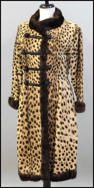 LEOPARD 3/4 LENGTH COAT.: LEOPARD 3/4 LENGTH COAT. Entirely trimmed in brown mink, with leather knot closures Approximately a size 4 - 6