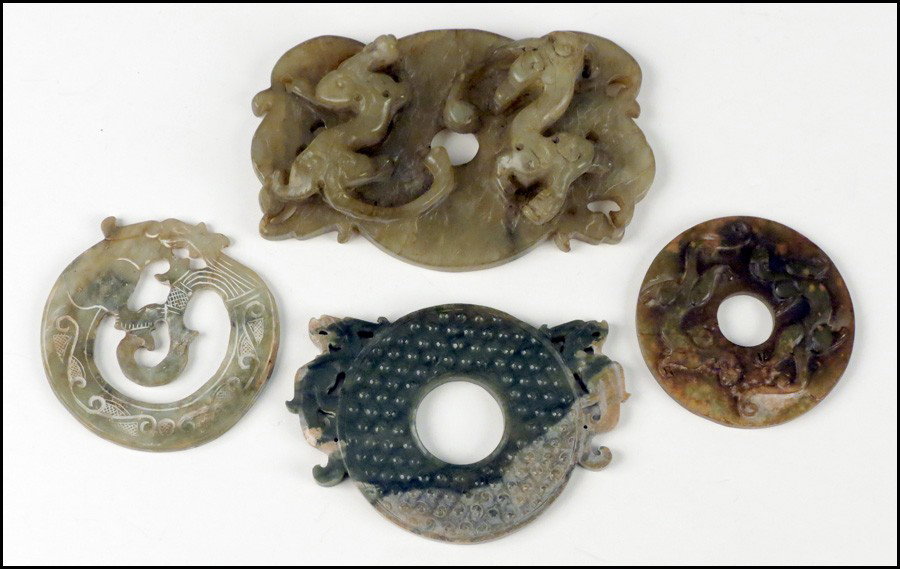 THREE CHINESE CARVED STONE BI.: THREE CHINESE CARVED STONE BI. Together with a carved soapstone bi Soapstone: 4" x 6"