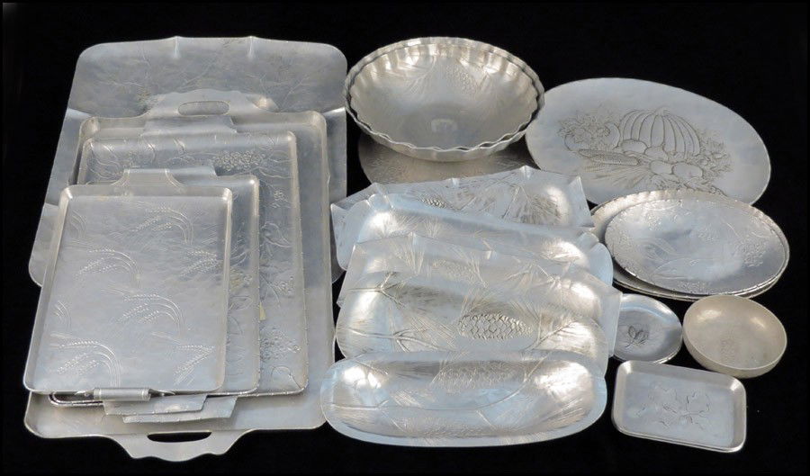 COLLECTION OF WENDELL FORGE HAMMERED ALUMINUM.: COLLECTION OF WENDELL FORGE HAMMERED ALUMINUM. Comprised of trays, platters, bowls, and decorative objects