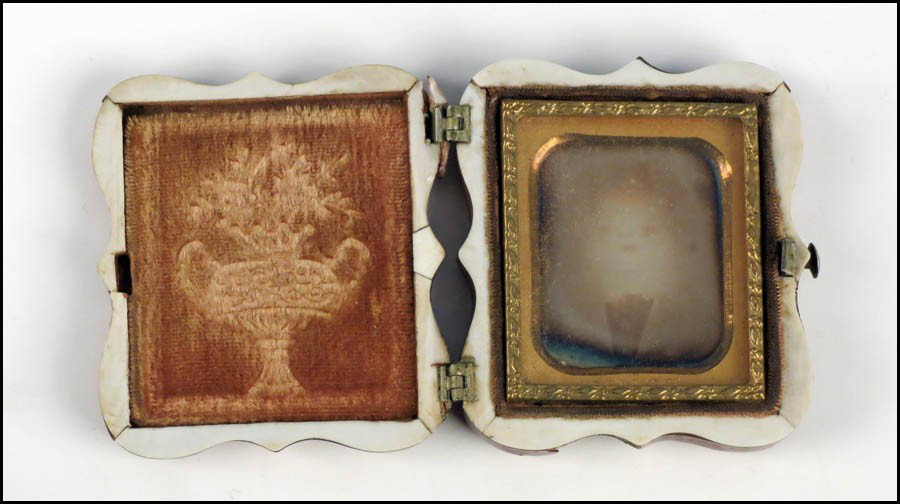 VICTORIAN TORTOISESHELL AND MOTHER OF PEARL IN: VICTORIAN TORTOISESHELL AND MOTHER OF PEARL INLAID CASE. Containing an ambrotype photograph Case: 2" x 2"
