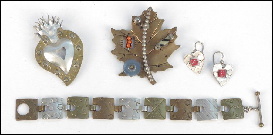 TWO THOMAS MANN BROOCHES.: TWO THOMAS MANN BROOCHES. Together with a Thomas Mann bracelet and pair of wireback earrings