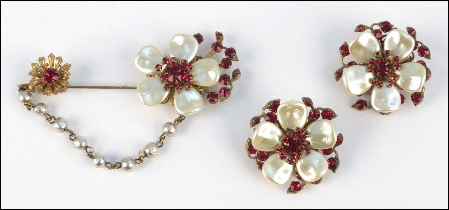 MIRIAM HASKELL FAUX PARL AND RED RHINESTONE DEM: MIRIAM HASKELL FAUX PARL AND RED RHINESTONE DEMI-PARURE. Comprised of a pair of floral earclips, and a stick pin