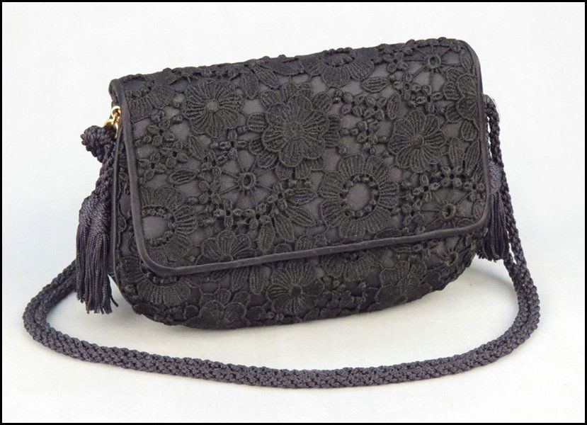 JUDITH LEIBER LACE EVENING BAG.: JUDITH LEIBER LACE EVENING BAG. With coin purse, mirror, and comb 5" x 8"