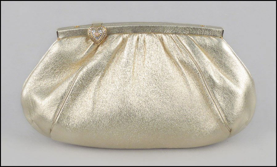 JUDITH LEIBER GOLD LEATHER CLUTCH HANDBAG.: JUDITH LEIBER GOLD LEATHER CLUTCH HANDBAG. With a heart closure, and coin purse 5.5" x 10"