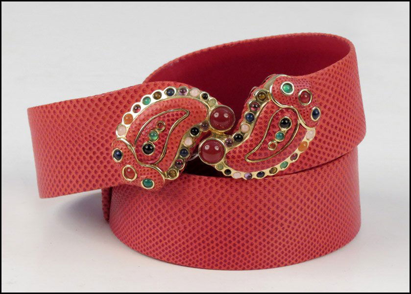 JUDITH LEIBER RED REPTILE SKIN BELT.: JUDITH LEIBER RED REPTILE SKIN BELT. With a rhinestone paisley closure