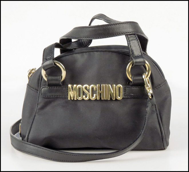 MOSCHINO BLACK NYLON AND LEATHER HANDBAG.: MOSCHINO BLACK NYLON AND LEATHER HANDBAG. With black leather handles, and a long removeable leather strap H: 5.5" W: 7.5" D: 4"
