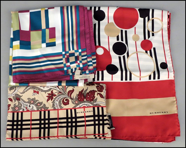 BURBERRY MULTI-COLORED SILK SCARF.: BURBERRY MULTI-COLORED SILK SCARF. Together with two Burberry silk scarves Multi-colored: 34" x 34"