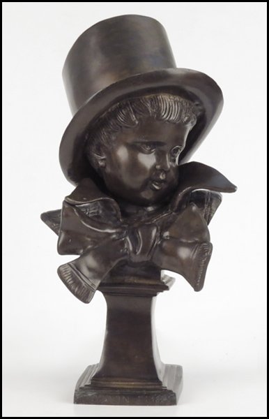 AFTER JEAN ANTOINE HOUDON (FRENCH, 1741 - 1828: AFTER JEAN ANTOINE HOUDON (FRENCH, 1741 - 1828) BUST OF A BOY WITH TOP HAT. Bronze, stamped on the base "Houdon, F: 1823" Height: 13.5"