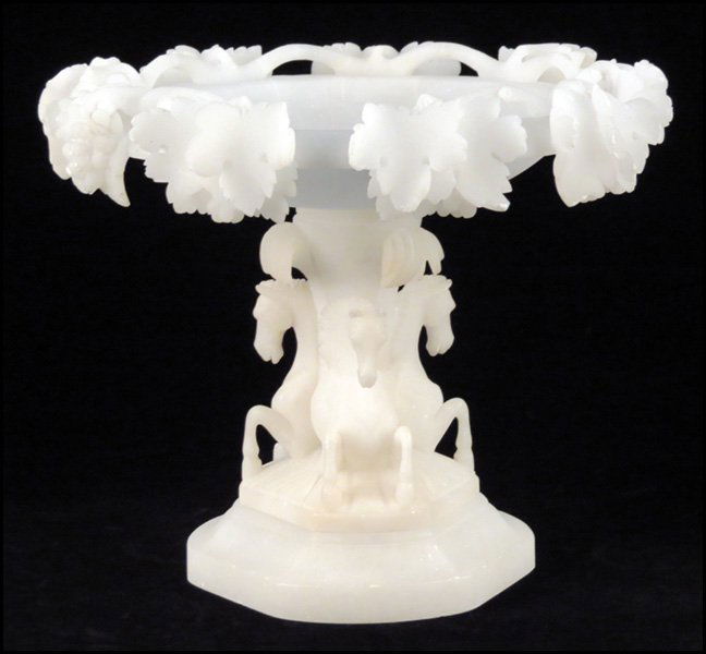 CARVED ALABASTER PEDESTAL DISH.: CARVED ALABASTER PEDESTAL DISH. Bearing a horse motif base, with leaves and grapes along the bowl's rim 10.25" x 12.5"
