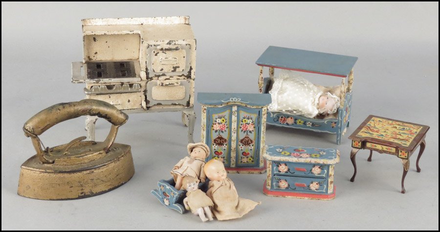GERMAN PAINTED DOLL FURNITURE.: GERMAN PAINTED DOLL FURNITURE. Comprising a canopy bed, cradle, and armoire. Together with an iron, a Chinoiserie style doll's table, four dolls, and an Arcade cast iron stove Stove: 7" x 7" x 3"