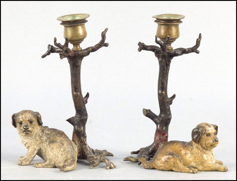 PAIR OF CONTINENTAL COLD PAINTED BRONZE CANDLE: PAIR OF CONTINENTAL COLD PAINTED BRONZE CANDLESTICKS. Depicting a seated dog underneath a tree. Underside bears impressed "Depose", and English registry marks Height: 7.25"