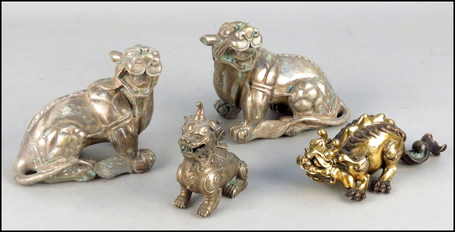PAIR OF PATINATED METAL FOO DOGS.: PAIR OF PATINATED METAL FOO DOGS. Together with a patinated metal foo dog, and a patinated metal dragon Height 7" x Length 7"