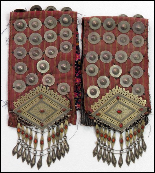 PAIR OF TURKOMAN SILVER AND CARNELIAN ROBE ORN: PAIR OF TURKOMAN SILVER AND CARNELIAN ROBE ORNAMENTS. Chapragy Changa decorations Length: 24"
