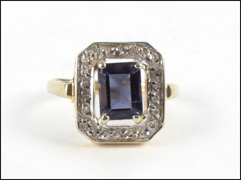 IOLITE, DIAMOND, AND 14 KARAT YELLOW GOLD RING: IOLITE, DIAMOND, AND 14 KARAT YELLOW GOLD RING. Emerald cut Iolite is approximately 1.5 carats. Surrounding single cut diamonds are I-J color, I1-I2 clarity, and total approximately .25 carat 3.9 gram