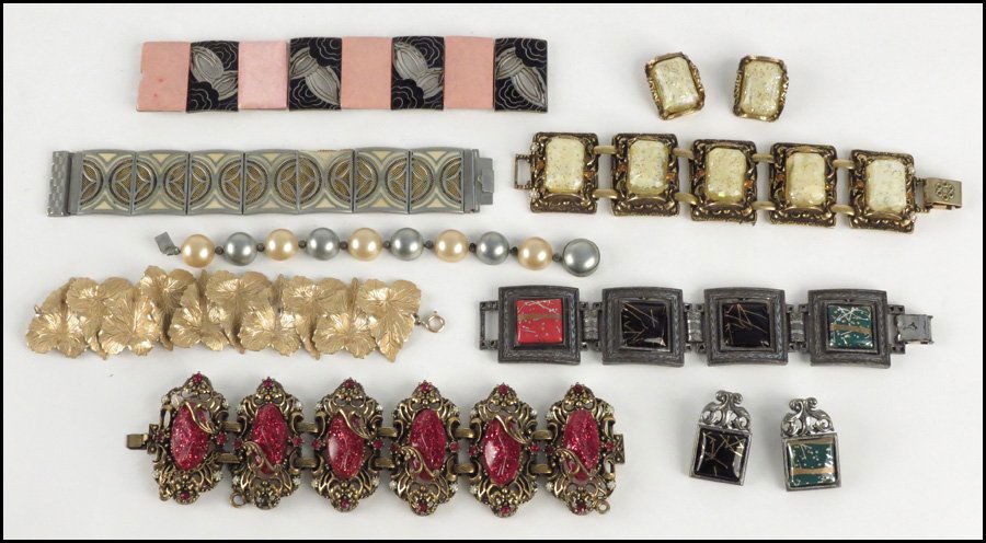 UNSIGNED ENAMEL DEMI-PARURE.: UNSIGNED ENAMEL DEMI-PARURE. Comprising a red, green, and black enamel bracelet and pair of screwback earrings. Enamel panels are reversible to display different colors. Together with a yellow plastic