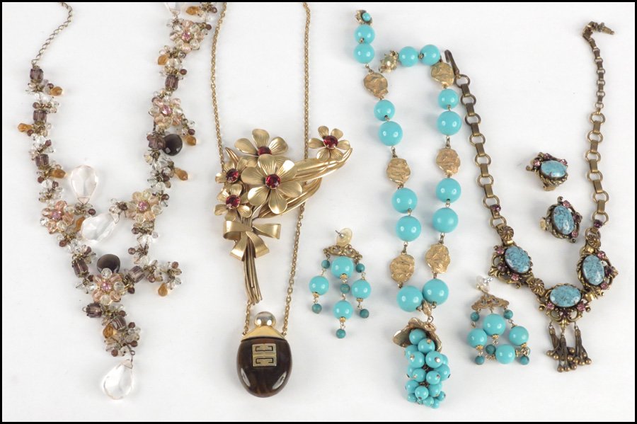 GIVENCHY BOTTLE FORM NECKLACE.: GIVENCHY BOTTLE FORM NECKLACE. Bearing a metal Givenchy tag dated 1978. Together with a faux turquoise necklace and pair of earrings, a rhinestone and faux turquoise necklace with matching earclips, a