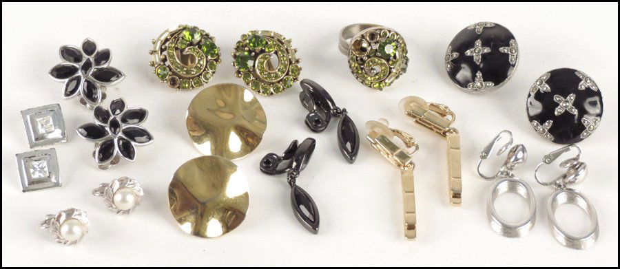 GROUP OF SIGNED EARCLIPS.: GROUP OF SIGNED EARCLIPS. Including Swarovski, Ciner, St. John, Givenchy, Monet, Trifari, and Majorica. Together with a pair of Hollycraft green rhinestone earclips and a matching ring