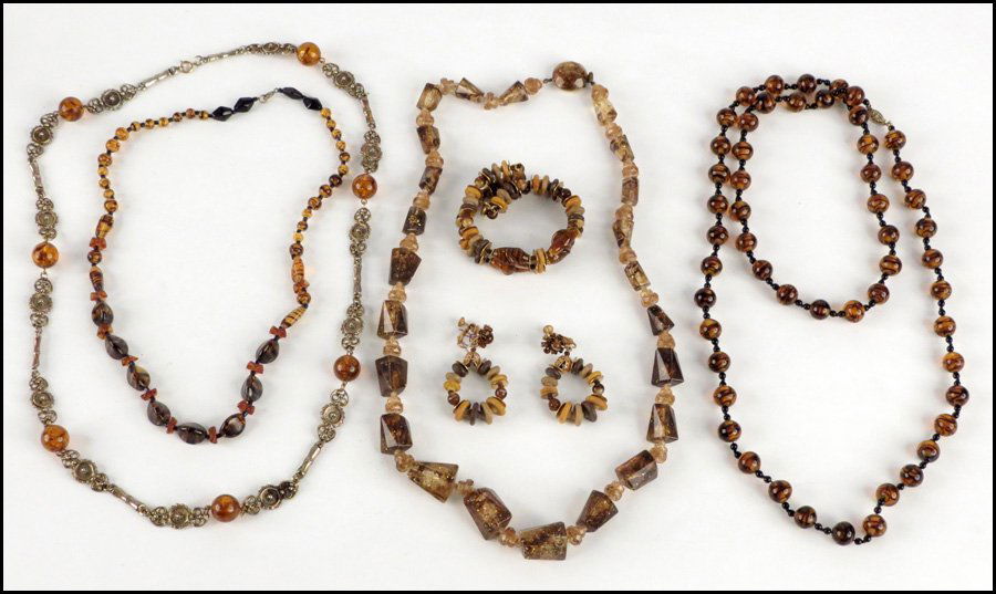 MIRIAM HASKELL DEMI-PARURE.: MIRIAM HASKELL DEMI-PARURE. Comprising a two-strand coil bracelet and a pair of earclips. Together with two amber colored glass bead necklaces, a gold tone link and amber colored plastic bead necklace