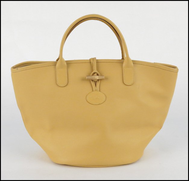 LONGCHAMP YELLOW LEATHER HANDBAG.: LONGCHAMP YELLOW LEATHER HANDBAG. With dustbag 10" x 16" x 7"