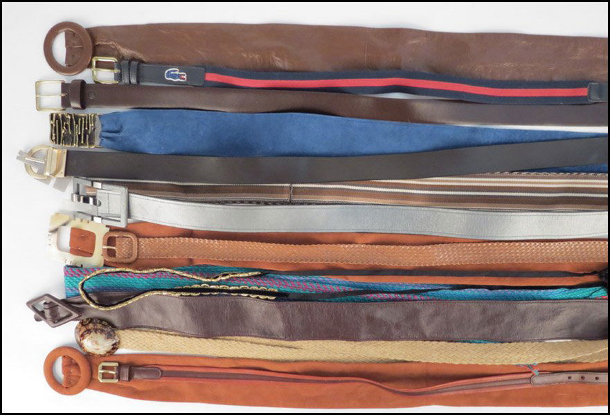 COLLECTION OF COTTON AND LEATHER BELTS.: COLLECTION OF COTTON AND LEATHER BELTS. Includes Lacoste, Ralph Lauren, Saks Fifth Avenue, and Coach belts