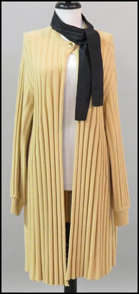 GIANFRANCO FERRE TAN RIBBED WOOL SWEATER COAT.: GIANFRANCO FERRE TAN RIBBED WOOL SWEATER COAT. With a black silk tieneck. Together with a pair of Gianfranco Ferre tan leather pants Sweater coat: Size 10
