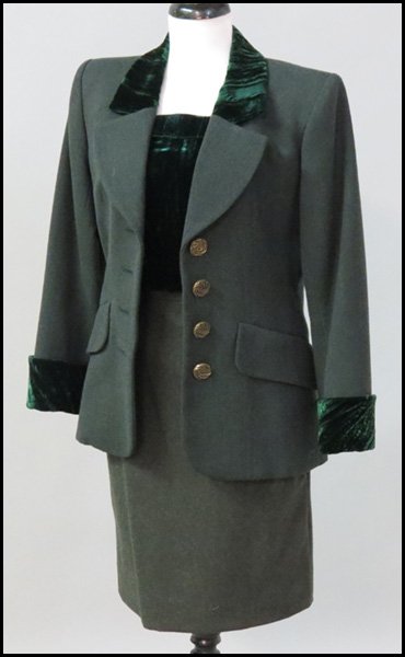 YVES SAINT LAURENT RIVE GAUCHE WOOL AND CRUSHED: YVES SAINT LAURENT RIVE GAUCHE WOOL AND CRUSHED VELVET ENSEMBLE. Comprising a four button jacket trimmed in velvet at the cuffs and collar, a velvet blouse, and a wool skirt All size 34
