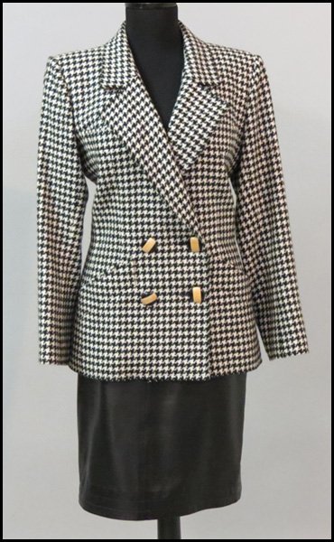 YVES SAINT LAURENT RIVE GAUCHE ENSEMBLE.: YVES SAINT LAURENT RIVE GAUCHE ENSEMBLE. Comprising a black and white wool houndstooth double breasted jacket, and a black leather skirt Jacket: size 40 Skirt: size 38