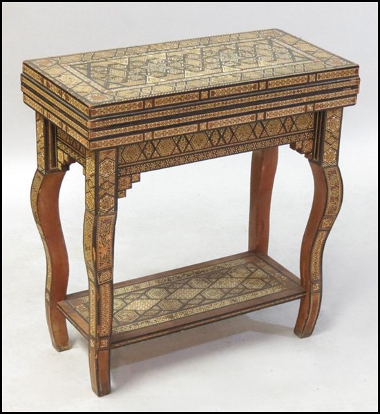 NORTH AFRICAN FLIP-TOP GAMES TABLE.: NORTH AFRICAN FLIP-TOP GAMES TABLE. Mixed inlay with mother-of-pearl. Flip top opens to reveal a removeable chess board, which conceals a backgammon board Closed: H: 29.5" W: 27.5" D: 14"