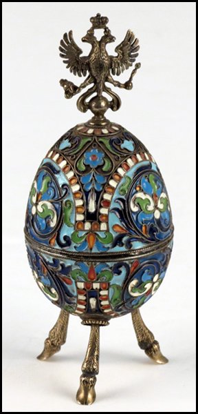 RUSSIAN CHAMPLEVE ENAMEL AND GILT SILV: RUSSIAN CHAMPLEVE ENAMEL AND GILT SILVER EGG. Having a Russian Imperial style finial and goldwashed interior. Interior rim of egg is stamped Faberge (in Cyrillic), 88, and the St. Petersburg stamp Hei