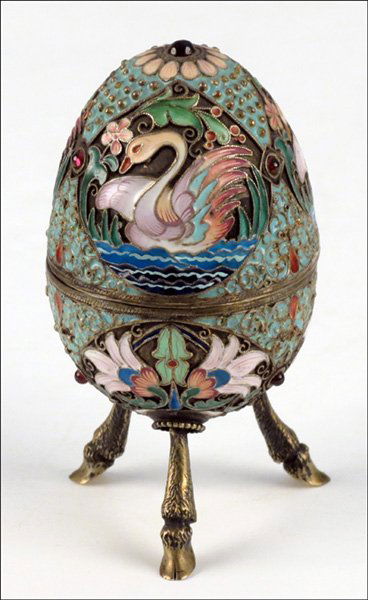 RUSSIAN CHAMPLEVE ENAMEL AND GILT SILVER EGG.: RUSSIAN CHAMPLEVE ENAMEL AND GILT SILVER EGG. Lower portion of egg bears impressed 84 silver standard, and TC. Interior is entirely goldwashed Height: 4"