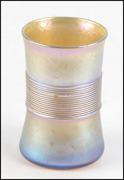 TIFFANY FAVRILE GLASS CUP.: TIFFANY FAVRILE GLASS CUP. Bearing glass threading along the middle section, Underside bears etched "L.C.T. T838" Height: 3"