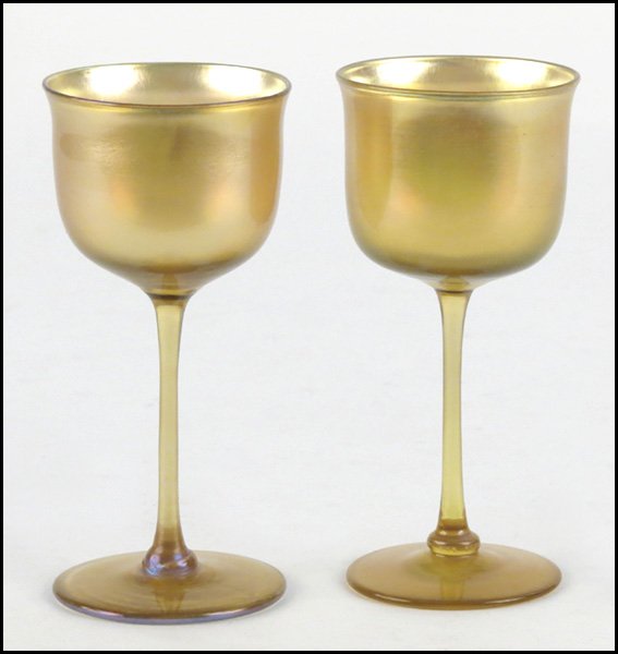 TWO TIFFANY FAVRILE GLASS GOBLETS.: TWO TIFFANY FAVRILE GLASS GOBLETS. Underside of each bears etched "L.C.T." underneath Height: 5.75"