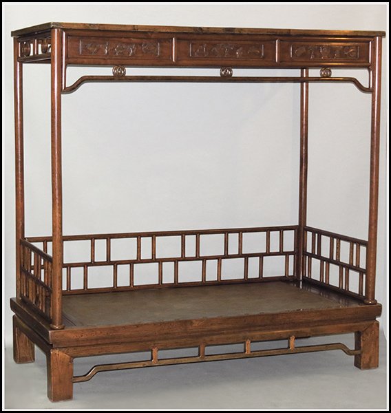 CHINESE HARDWOOD OPIUM BED.: CHINESE HARDWOOD OPIUM BED. Bearing scholar's carvings throughout H: 82" W: 84" D: 40"