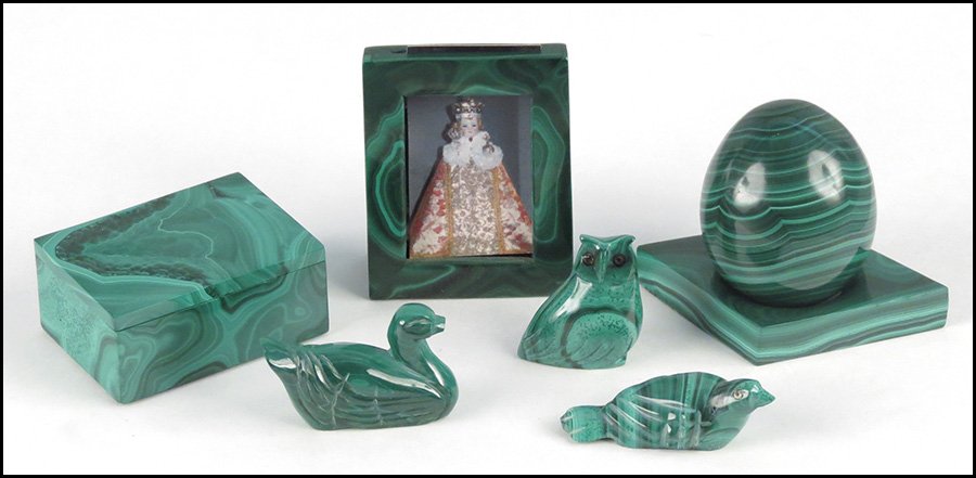 COLLECTION OF CARVED MALACHITE DECORATIVE ITEM: COLLECTION OF CARVED MALACHITE DECORATIVE ITEMS. Comprised of a frame, a box, an egg on a stand, and three birds Box: H: 1" W: 2.5" D: 1.5"