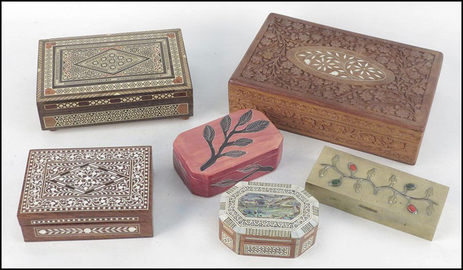 SIX DECORATIVE BOXES.: SIX DECORATIVE BOXES. Comprised of wood and shell inlaid, carved wood, carved stone, and patinated metal boxes H: 3" W: 12" D: 8"