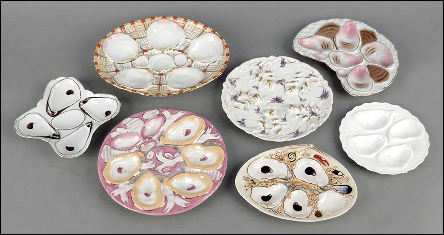 GROUP OF EIGHT PORCELAIN OYSTER PLATES.: GROUP OF EIGHT PORCELAIN OYSTER PLATES. Minton, Theodore Haviland, Union Porcelain Works, and others Largest diameter: 9.5"