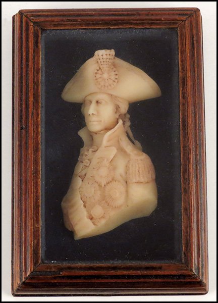CARVED WAX REGIMENTAL PORTRAIT BUST.: CARVED WAX REGIMENTAL PORTRAIT BUST. Mounted in a carved wood shadow box. Framed 6" x 4" Bust hieght 4"