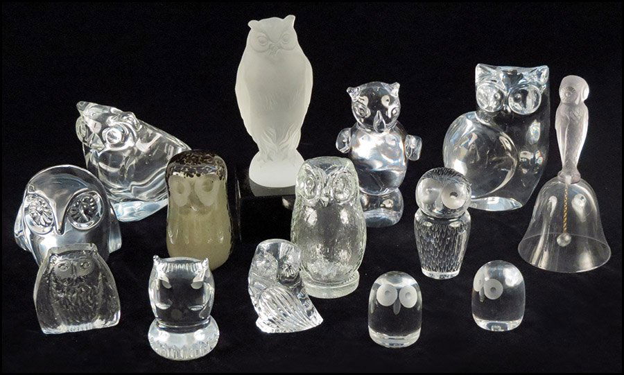 COLLECTION OF THIRTEEN GLASS OWLS.: COLLECTION OF THIRTEEN GLASS OWLS. Makers include Olle Alberius for Orrefors, Wedgwood, Hadeland, Waterford, Spode, and Linstrand for Kosta. Together with an owl form bell Tallest 8.5"