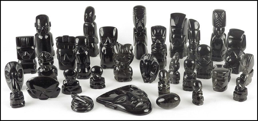 COLLECTION OF TRIBAL OBSIDIAN CARVINGS.: COLLECTION OF TRIBAL OBSIDIAN CARVINGS. Including figures and animals, and a mask signed on the reverse "Zorteka?". Mask: 7" x 6.5" Tallest figure: 8"