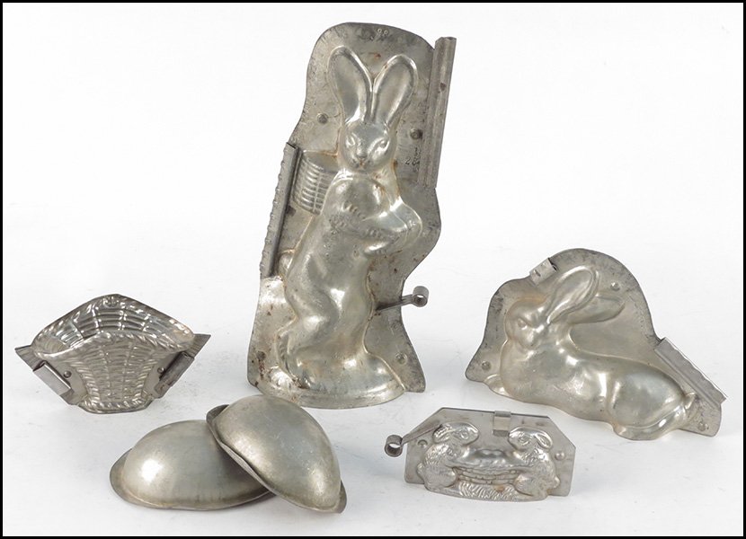 THREE RABBIT FORM CHOCOLATE MOLDS.: THREE RABBIT FORM CHOCOLATE MOLDS. Together with a egg form and basket form mold Tallest height 12.5"
