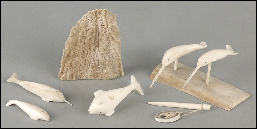 PAIR OF CARVED BONE NARWHALE.: PAIR OF CARVED BONE NARWHALE. Maker M. Tunnuck from Pelly Bay, 1975. Mounted on a bone shard. Together with a group of three carved bone whales mounted on a bone shard one whale length 3.25"