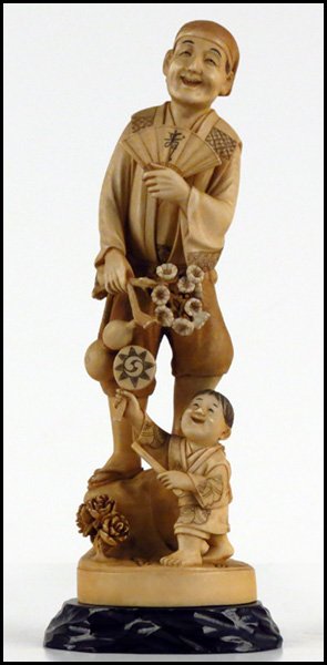 JAPANESE CARVED IVORY FIGURE OF A MAN WITH A FAN AND A : JAPANESE CARVED IVORY FIGURE OF A MAN WITH A FAN AND A CHILD. Provenance: The Collection of G. Jules Marder, past president of the Oriental Art Club of Chicago H:11"