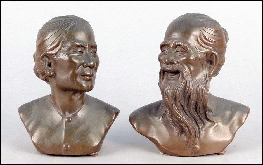 PAIR OF GIA LOI VIETNAMESE PATINATED BRONZE BUSTS.: PAIR OF GIA LOI VIETNAMESE PATINATED BRONZE BUSTS. One depicting a woman, and the other a bearded man. Both are signed Gia Loi along the base Man height: 7"