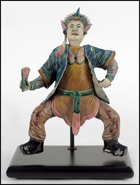 CHINESE GLAZED POTTERY ROOF TILE.: CHINESE GLAZED POTTERY ROOF TILE. Depicting a figure holding a fan. Mounted to a metal and wood base Figure: 14" x 10" x 3"