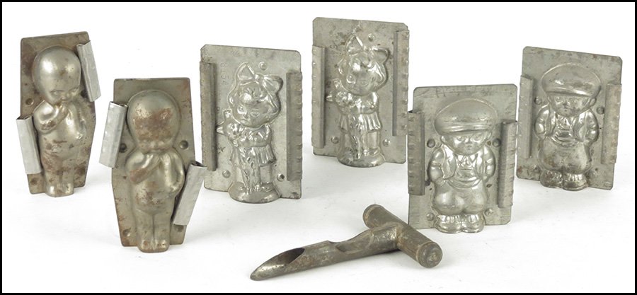 COLLECTION OF CHILD FIGURE CHOCOLATE MOLDS.: COLLECTION OF CHILD FIGURE CHOCOLATE MOLDS. Comprised of two boys, two girls, two cupie doll molds. Together with a candy making tool Tallest height 5.5"