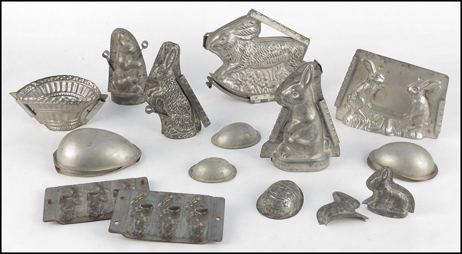 COLLECTION OF EASTER CHOCOLATE MOLDS.: COLLECTION OF EASTER CHOCOLATE MOLDS. Includes six rabbit molds, a basket mold, three eggs, and a half egg. Includes Eppelsheimer molds height 8"