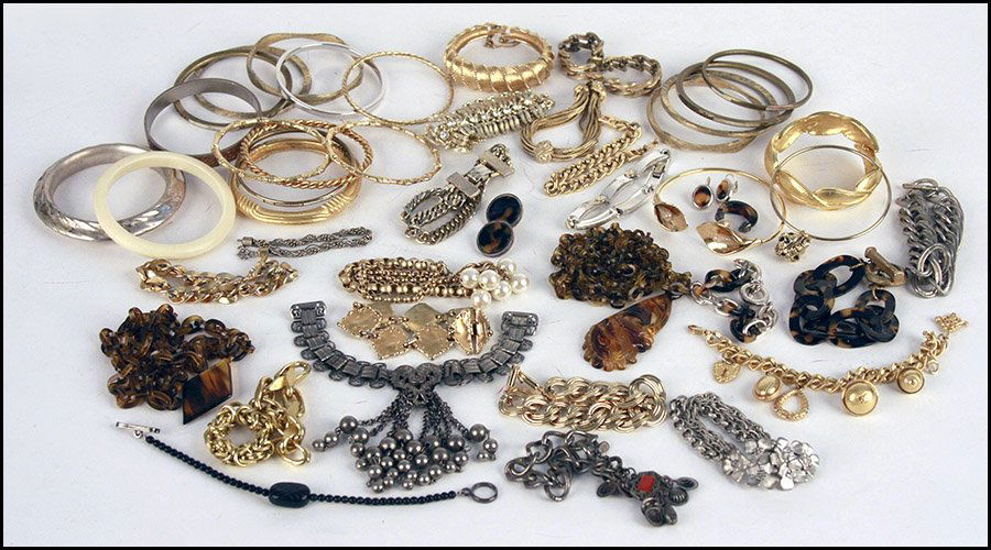 COLLECTION OF BRACELETS.: COLLECTION OF BRACELETS. Including cuff, bangle and link bracelets by Monet, Lisner, Hattie Carnegie, Erwin Pearl, Oscar de la Renta, and others